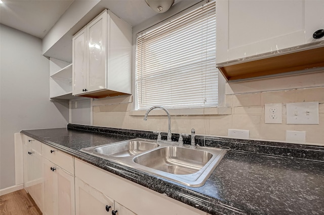 23131 Earlmist Dr, Spring, TX 77373 - kitchen with white cabinets, open shelves, dark countertops, and light wood-type flooring