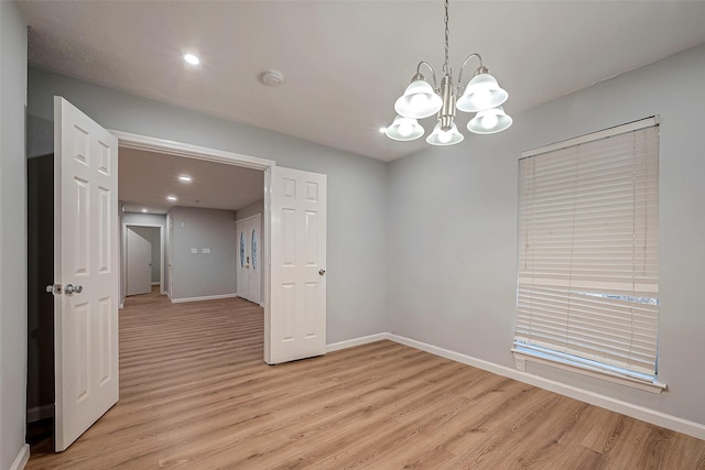 23131 Earlmist Dr, Spring, TX 77373 - spare room featuring a smoke detector, light wood-type flooring, a chandelier, and recessed lighting