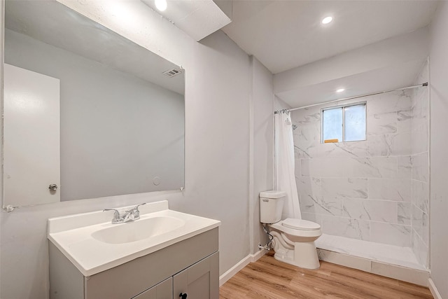 23131 Earlmist Dr, Spring, TX 77373 - full bathroom with vanity, wood finished floors, tiled shower, and recessed lighting