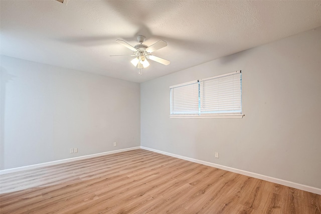 23131 Earlmist Dr, Spring, TX 77373 - unfurnished room with light wood finished floors, a ceiling fan, and a textured ceiling