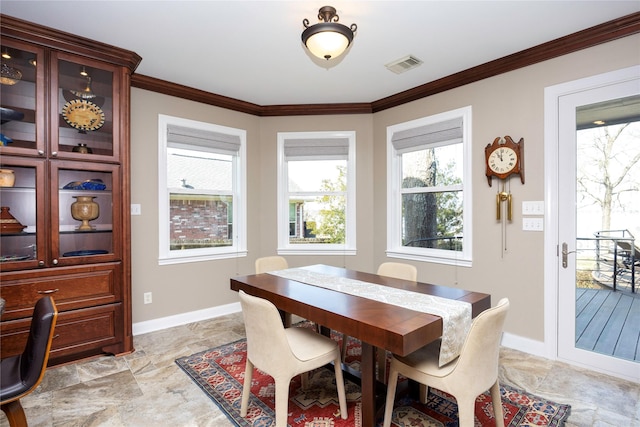 1906 Nogalus Dr, Houston, TX 77532 - dining space featuring ornamental molding and light stone finish floors