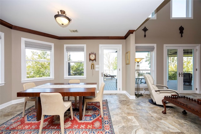 1906 Nogalus Dr, Houston, TX 77532 - dining space with french doors, crown molding, and light stone finish floors