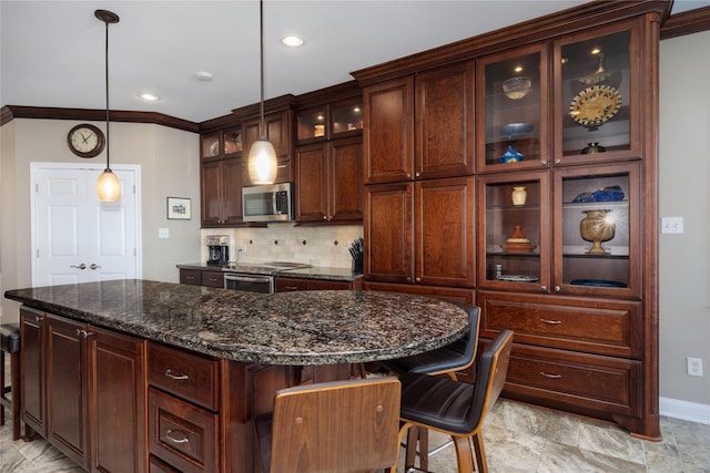 1906 Nogalus Dr, Houston, TX 77532 - kitchen with appliances with stainless steel finishes, hanging light fixtures, tasteful backsplash, a kitchen bar, and a kitchen island