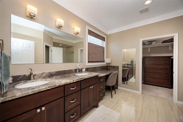 1906 Nogalus Dr, Houston, TX 77532 - full bath featuring ornamental molding, double vanity, and a walk in closet