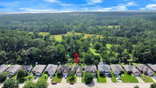 7807 Board Xing, Conroe, TX 77304 - aerial perspective of suburban area featuring a heavily wooded area