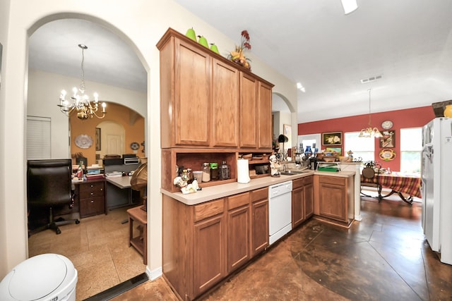 7807 Board Xing, Conroe, TX 77304 - kitchen featuring white appliances, arched walkways, a peninsula, light countertops, and a chandelier