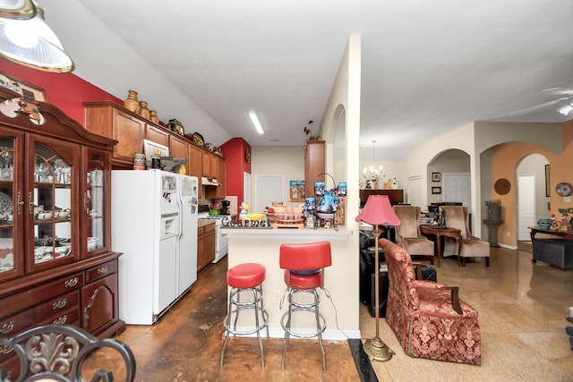 7807 Board Xing, Conroe, TX 77304 - kitchen featuring white appliances, arched walkways, a kitchen breakfast bar, light countertops, and a peninsula