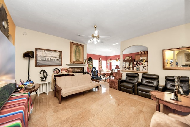 7807 Board Xing, Conroe, TX 77304 - living room featuring a ceiling fan and a fireplace