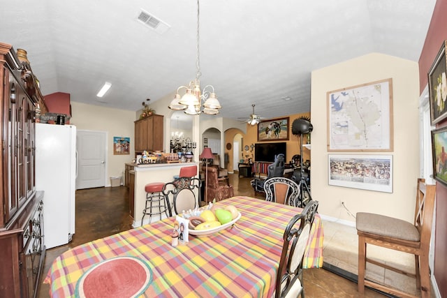 7807 Board Xing, Conroe, TX 77304 - dining space featuring arched walkways, vaulted ceiling, a chandelier, finished concrete flooring, and ceiling fan