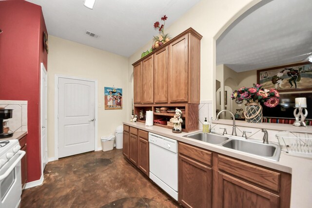 7807 Board Xing, Conroe, TX 77304 - kitchen with white appliances, arched walkways, light countertops, and finished concrete floors