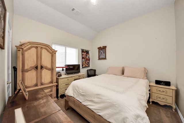 7807 Board Xing, Conroe, TX 77304 - carpeted bedroom featuring vaulted ceiling and baseboards