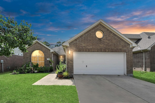 7807 Board Xing, Conroe, TX 77304 - ranch-style house with brick siding, concrete driveway, a front yard, and a garage