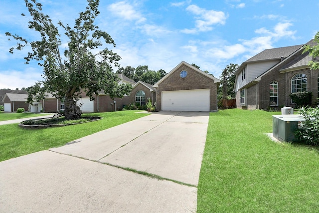 7807 Board Xing, Conroe, TX 77304 - traditional-style home featuring driveway, an attached garage, a front yard, and brick siding