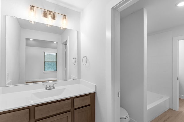 19209 Olive Heath Ln, Magnolia, TX 77355 - full bath with vanity, wood finished floors, and washtub / shower combination