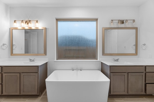 19209 Olive Heath Ln, Magnolia, TX 77355 - full bath featuring a soaking tub and two vanities