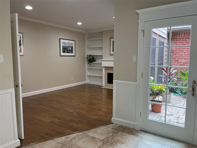 7447 Cambridge St Unit 18, Houston, TX 77054 - interior space with ornamental molding, wood finished floors, recessed lighting, and a fireplace with flush hearth