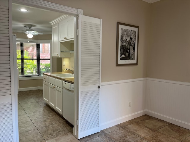 7447 Cambridge St Unit 18, Houston, TX 77054 - hall featuring light tile patterned floors and wainscoting
