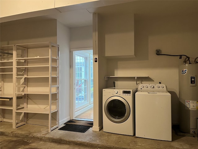 7447 Cambridge St Unit 18, Houston, TX 77054 - washroom featuring electric water heater and washing machine and clothes dryer