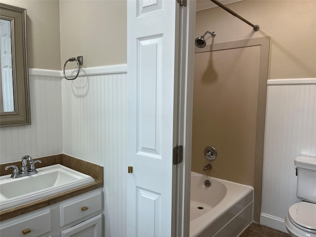 7447 Cambridge St Unit 18, Houston, TX 77054 - bathroom with vanity, bathtub / shower combination, and wainscoting