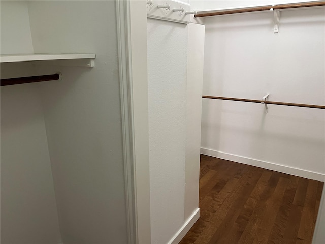 7447 Cambridge St Unit 18, Houston, TX 77054 - walk in closet featuring dark wood-style flooring