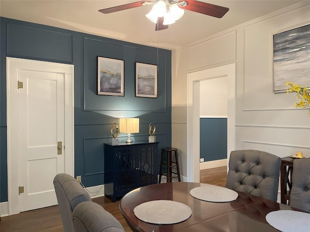 338 Cortlandt St, Houston, TX 77007 - dining space with a decorative wall, a ceiling fan, and dark wood-style floors