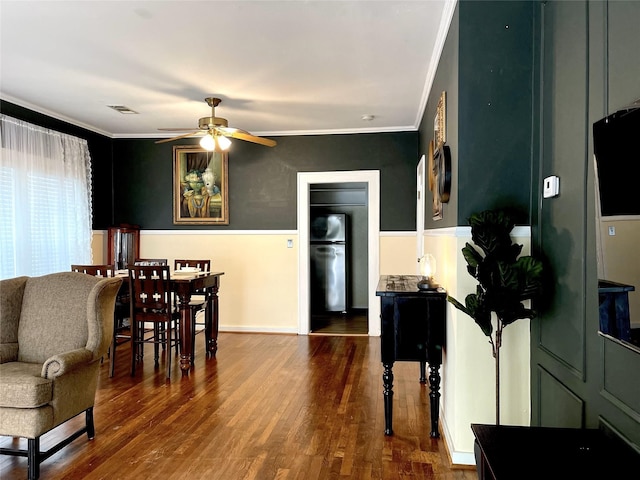 338 Cortlandt St, Houston, TX 77007 - dining room with crown molding, ceiling fan, and wood finished floors