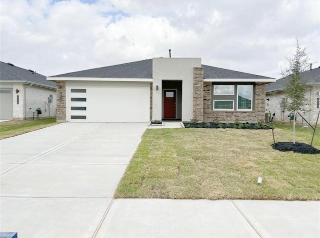 29526 Paytons Park Ln, Katy, TX 77494 - contemporary house with a garage, concrete driveway, a front lawn, brick siding, and a shingled roof