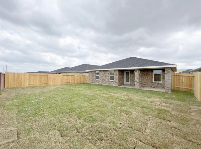 29526 Paytons Park Ln, Katy, TX 77494 - rear view of house featuring a patio, a fenced backyard, and brick siding
