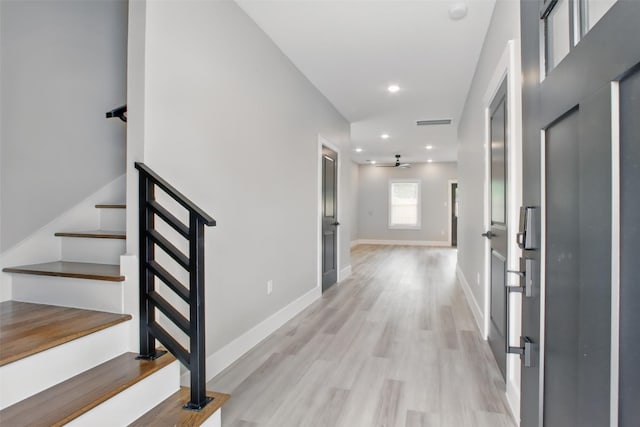4719 Mallow St, Houston, TX 77033 - foyer featuring light wood-style flooring, ceiling fan, recessed lighting, and stairs