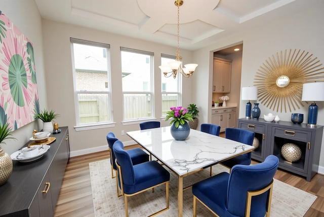 4407 Archer Meadow Ln, Sugar Land, TX 77479 - dining area featuring coffered ceiling, a chandelier, light wood-style floors, and beam ceiling