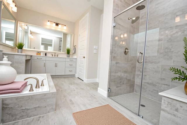 4407 Archer Meadow Ln, Sugar Land, TX 77479 - full bathroom with a stall shower, a garden tub, and vanity