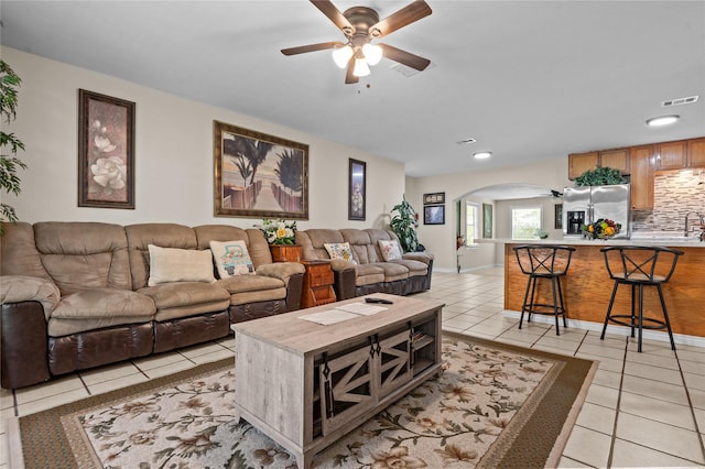 413 Susan St, Lufkin, TX 75901 - living room featuring arched walkways, a ceiling fan, light tile patterned flooring, and recessed lighting