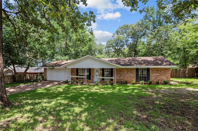413 Susan St, Lufkin, TX 75901 - ranch-style home featuring brick siding, a garage, covered porch, and concrete driveway