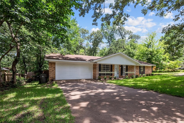 413 Susan St, Lufkin, TX 75901 - ranch-style home with brick siding, driveway, an attached garage, and a porch