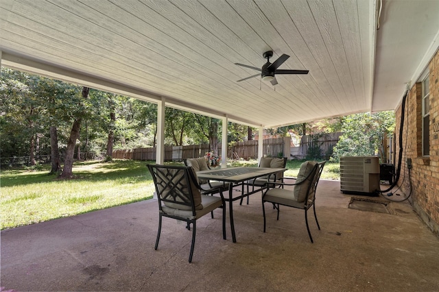413 Susan St, Lufkin, TX 75901 - fenced backyard with outdoor dining space, a patio area, and ceiling fan