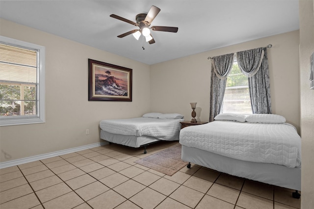 413 Susan St, Lufkin, TX 75901 - bedroom featuring light tile patterned flooring and a ceiling fan