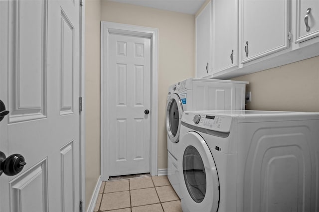 413 Susan St, Lufkin, TX 75901 - washroom with cabinet space, washing machine and dryer, and light tile patterned floors