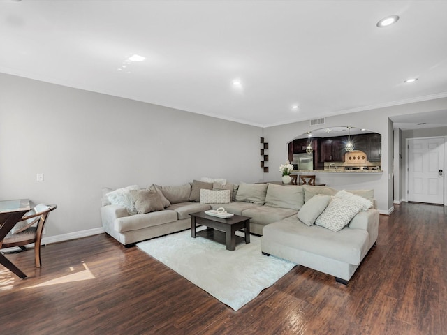 1615 S Kirkwood Rd, Houston, TX 77077 - living area featuring dark wood finished floors, crown molding, recessed lighting, and arched walkways