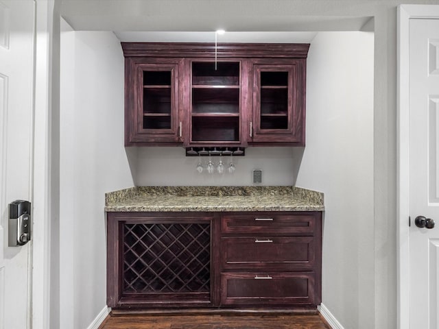 1615 S Kirkwood Rd, Houston, TX 77077 - indoor dry bar with baseboards and dark wood-style floors