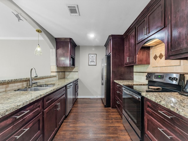 1615 S Kirkwood Rd, Houston, TX 77077 - kitchen with appliances with stainless steel finishes, dark brown cabinets, light stone counters, decorative backsplash, and crown molding