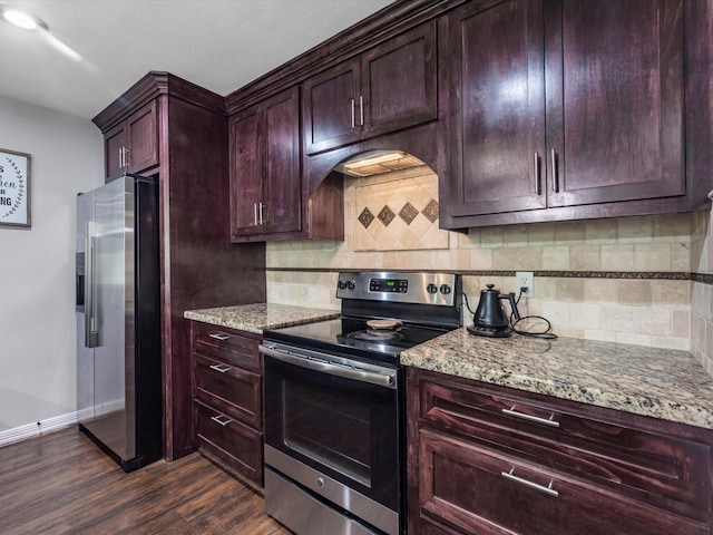 1615 S Kirkwood Rd, Houston, TX 77077 - kitchen featuring stainless steel appliances, light stone countertops, dark wood-style floors, and backsplash
