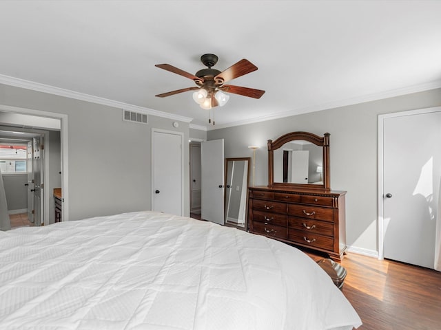 1615 S Kirkwood Rd, Houston, TX 77077 - bedroom with crown molding, wood finished floors, and a ceiling fan