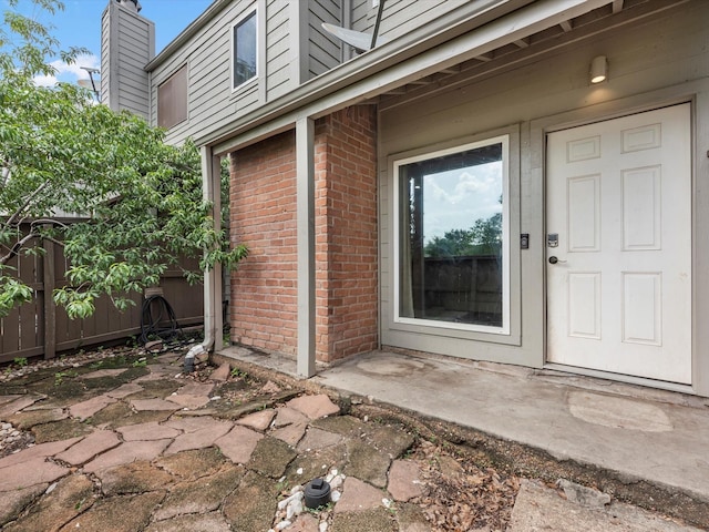 1615 S Kirkwood Rd, Houston, TX 77077 - entrance to property featuring brick siding and a chimney