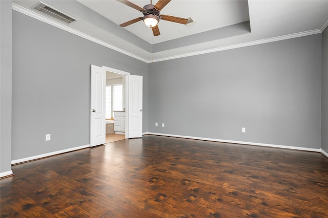 25303 Hall Meadow Ln, Katy, TX 77494 - empty room with ceiling fan, wood finished floors, ornamental molding, and a tray ceiling