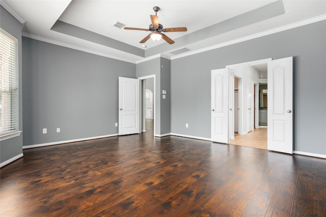 25303 Hall Meadow Ln, Katy, TX 77494 - unfurnished bedroom with a raised ceiling, multiple windows, wood finished floors, crown molding, and a ceiling fan