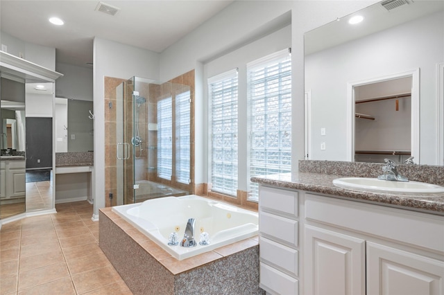 25303 Hall Meadow Ln, Katy, TX 77494 - full bathroom featuring vanity, a stall shower, healthy amount of natural light, a whirlpool tub, and recessed lighting