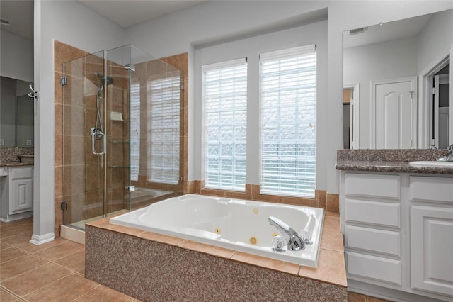 25303 Hall Meadow Ln, Katy, TX 77494 - bathroom with vanity, a shower stall, a jetted tub, and tile patterned flooring
