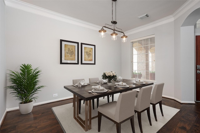 25303 Hall Meadow Ln, Katy, TX 77494 - dining area with arched walkways, ornamental molding, and dark wood-style floors