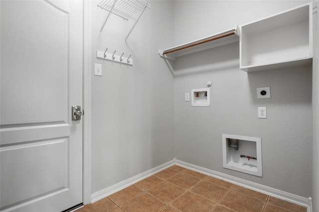 25303 Hall Meadow Ln, Katy, TX 77494 - laundry room with electric dryer hookup, washer hookup, hookup for a gas dryer, and dark tile patterned floors