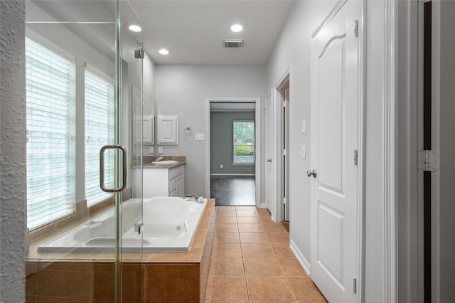 25303 Hall Meadow Ln, Katy, TX 77494 - bathroom featuring vanity, a garden tub, a shower stall, tile patterned flooring, and recessed lighting